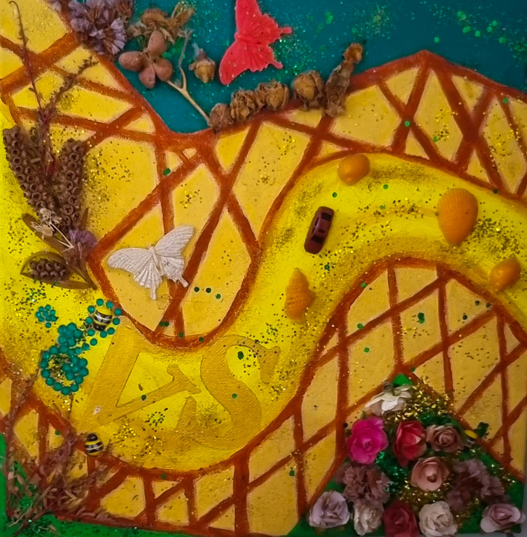 Varinia's artwork - Colorful mixed media artwork featuring a winding yellow road adorned with natural elements like dried flowers and butterflies. The composition includes a small red toy car and decorative shells, creating a vibrant and playful scene.