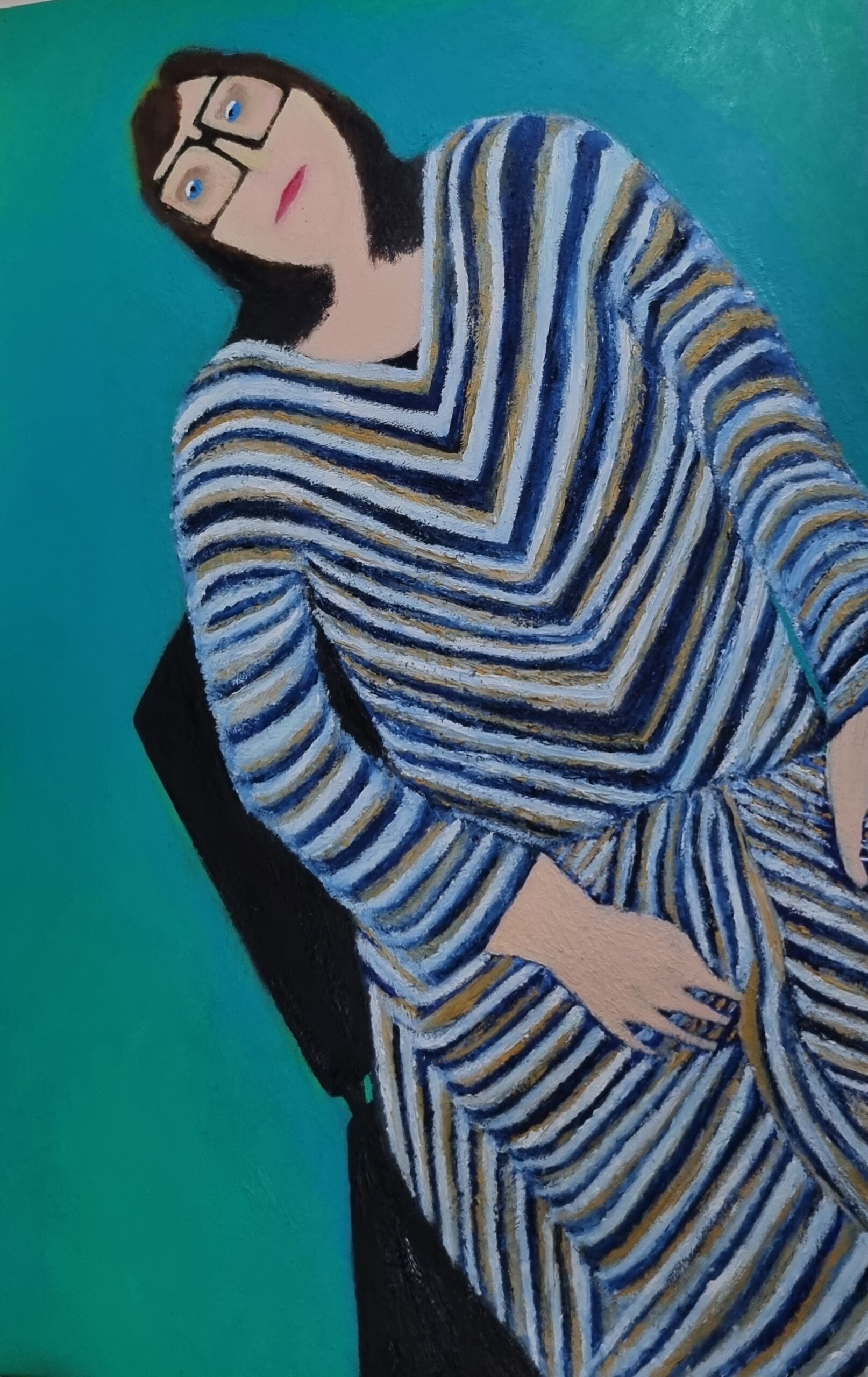 A woman of unspecified ethnicity is seated, wearing a blue and white striped dress with a v-neckline and long sleeves. She has a neutral facial expression and is holding her hands on her lap. The background features a solid color.